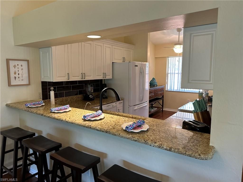 321 Robin Hood Cir, Unit 201, Naples, FL 34104 Photo