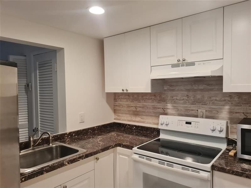 300 Golden Isles Drive, Unit 104, Hallandale Beach, FL 33009 Photo