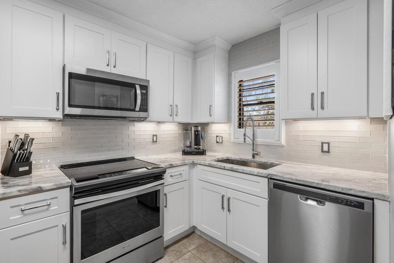 2420 Deer Creek Country Club Boulevard, Unit 205-D, Deerfield Beach, FL 33442 Main Photo