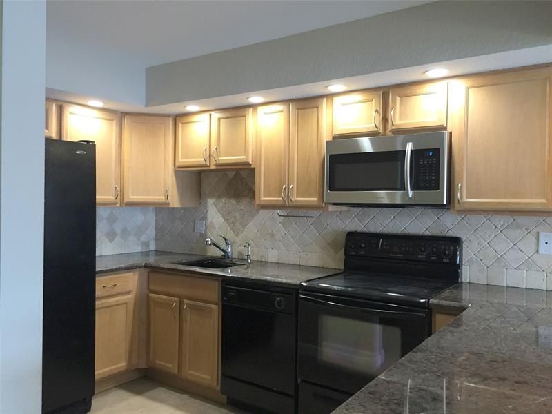 1100 Crystal Lake Drive, Unit 110, Deerfield Beach, FL 33064 Main Photo