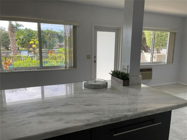 455 Golden Isles Dr, Unit 107, Hallandale Beach, FL 33009