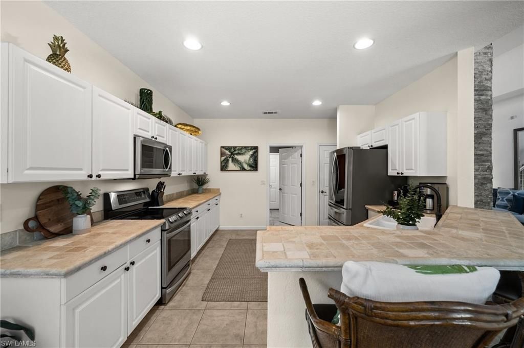 6996 Burnt Sienna Cir, Naples, FL 34109 Photo