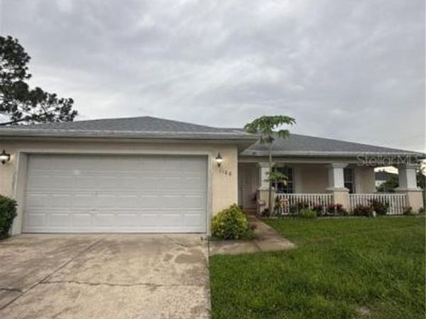1106 SUMMA BOULEVARD, LEHIGH ACRES, FL 33974