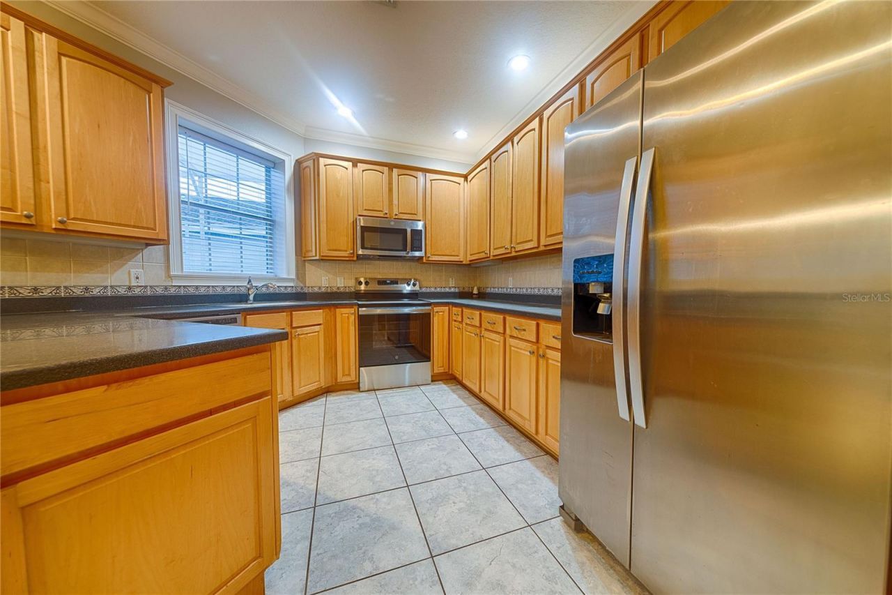 7019 Five Oaks Drive, Harmony, FL 34773 Photo