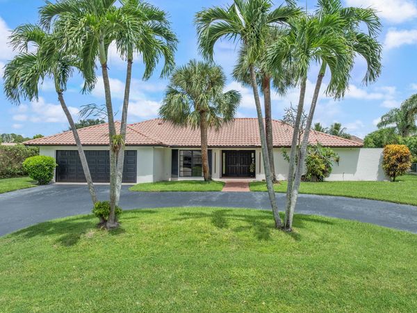 516 Muirfield Drive, Atlantis, FL 33462