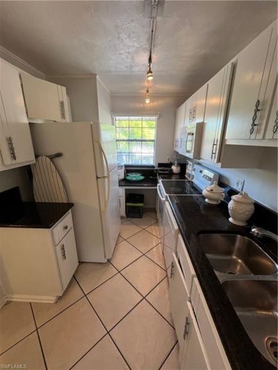 5379 Treetops Dr, Unit M203, Naples, FL 34113 Photo