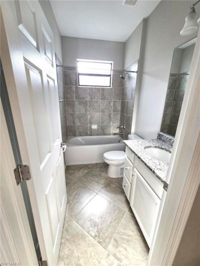 9163 Woodhurst Dr, Naples, FL 34120 Photo