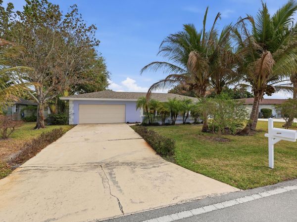 9696 Honeysuckle Avenue, Palm Beach Gardens, FL 33410