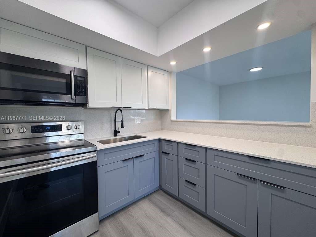 455 Golden Isles Dr , Unit 203, Hallandale Beach, FL 33009 Photo