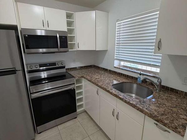 9851 Sandalfoot Boulevard, Unit 220, Boca Raton, FL 33428