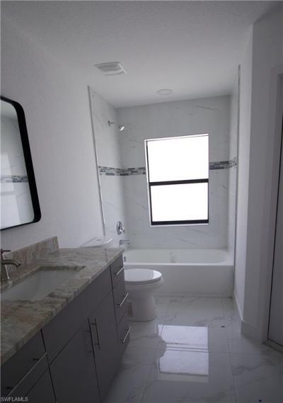 118 Parish Dr , Lehigh Acres, FL 33974 Photo