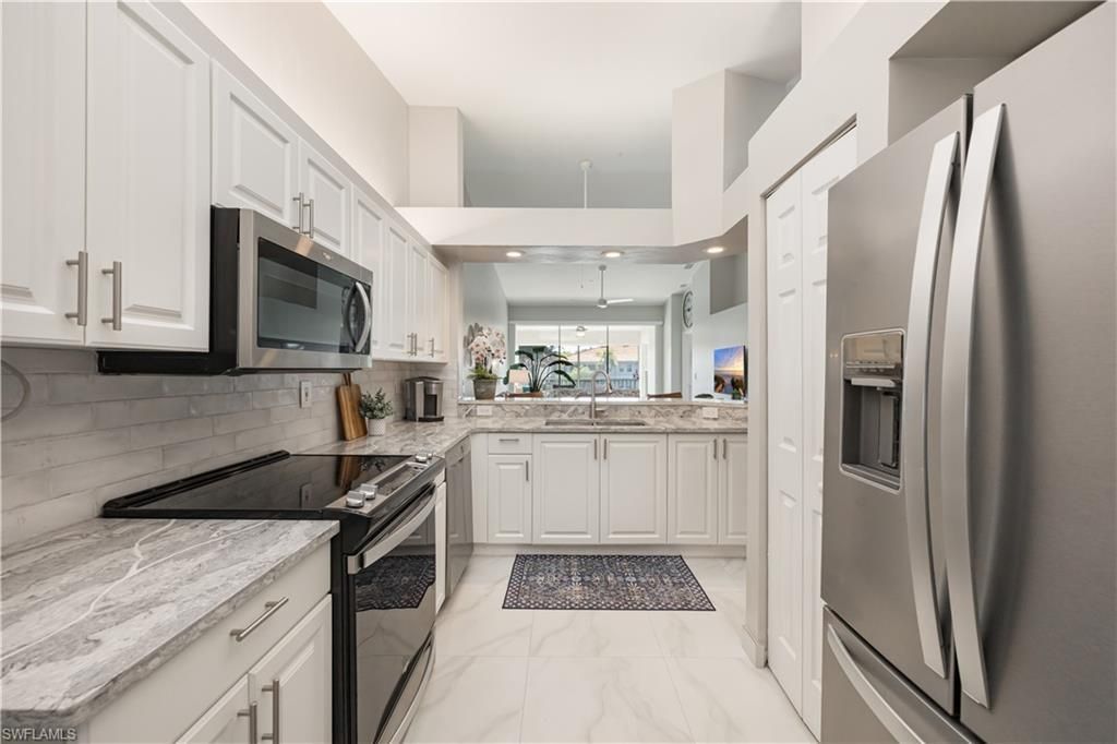 7564 Silver Trumpet Ln , Unit U202, Naples, FL 34109 Photo