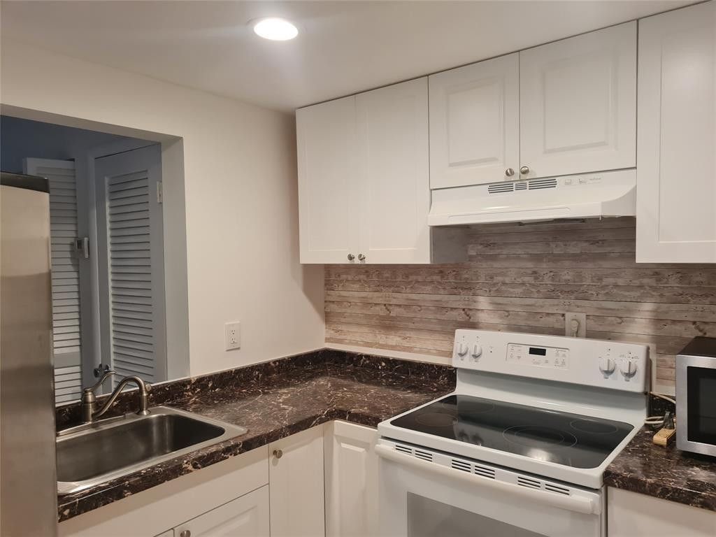 300 Golden Isles Drive, Unit 104, Hallandale Beach, FL 33009 Photo