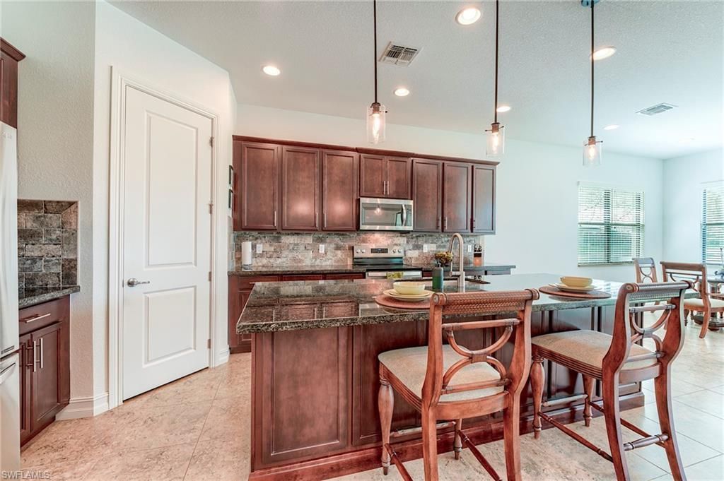 9209 Woodhurst Dr , Naples, FL 34120 Photo