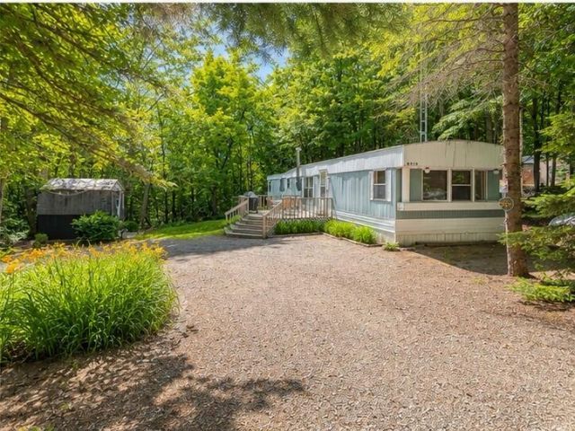 8470 Heatherton Circle, Mancelona, MI 49659 Main Photo