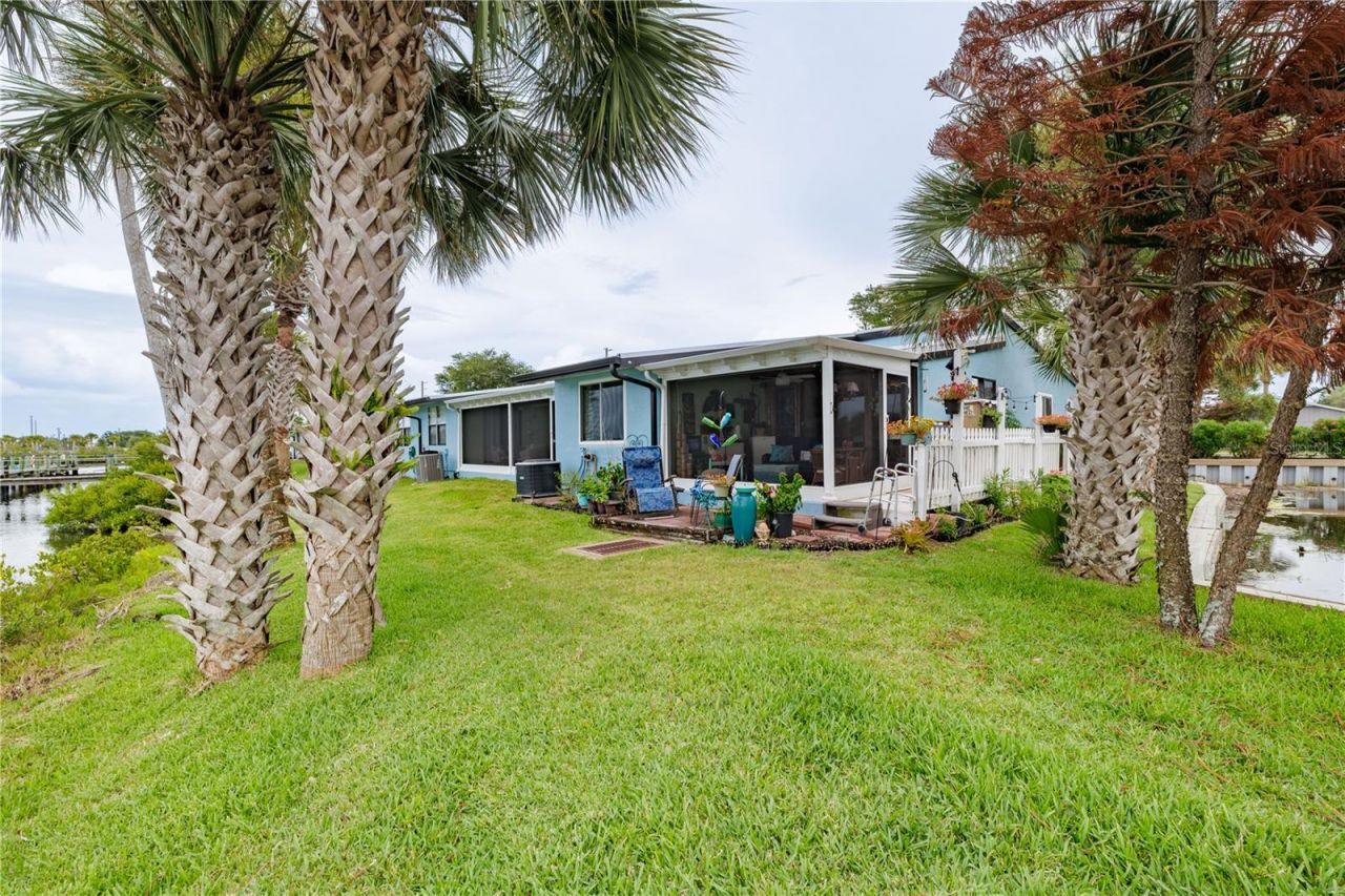 100 Poinciana Cove Court, Unit 100, New Smyrna Beach, FL 32169 Photo