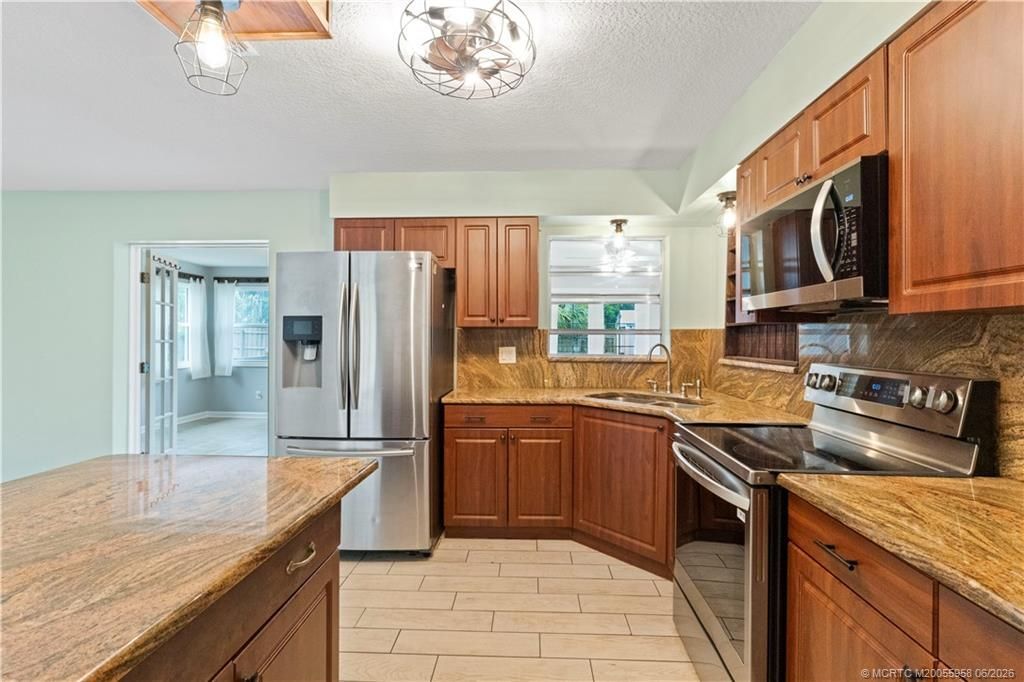 1028 NE Hansen Terrace, Jensen Beach, FL 34957 Photo
