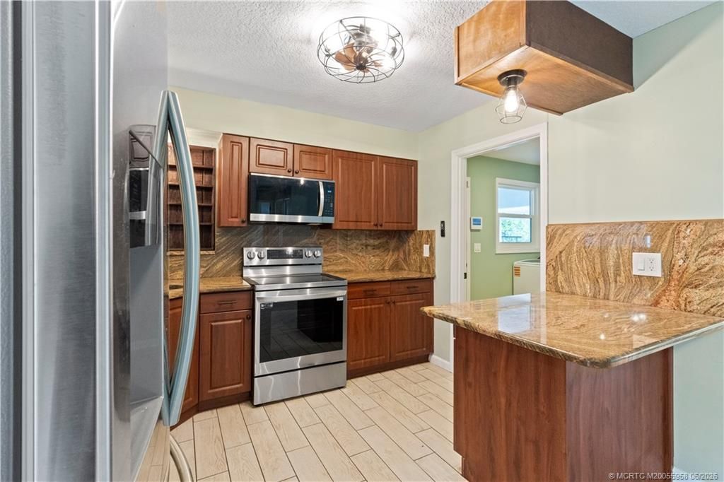 1028 NE Hansen Terrace, Jensen Beach, FL 34957 Photo