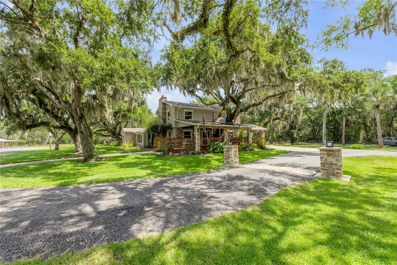 800 Hidden Oaks Lane, Oak Hill, FL 32759 Photo