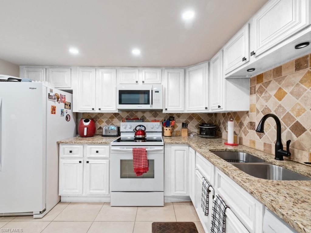 151 Cypress Way E, Unit E101, Naples, FL 34110 Photo