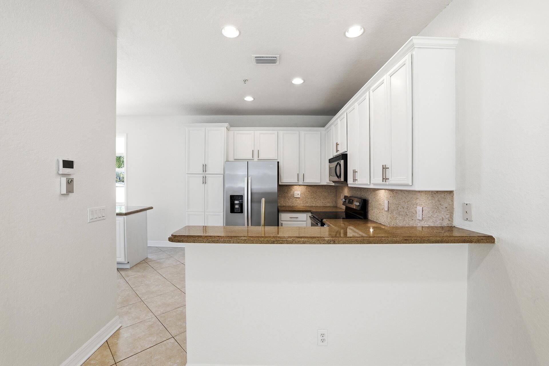127 E Thatch Palm Circle, Jupiter, FL 33458 Photo