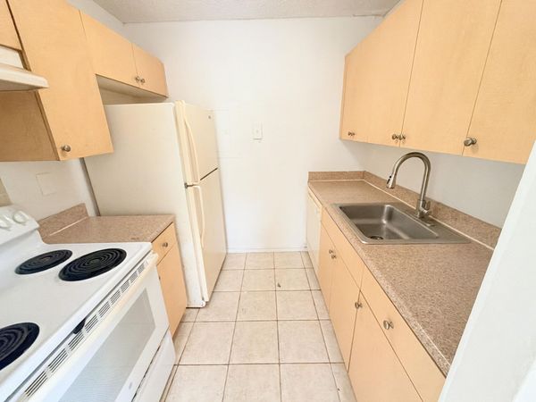 1089 N BENOIST FARMS Road, Unit 102, West Palm Beach, FL 33411