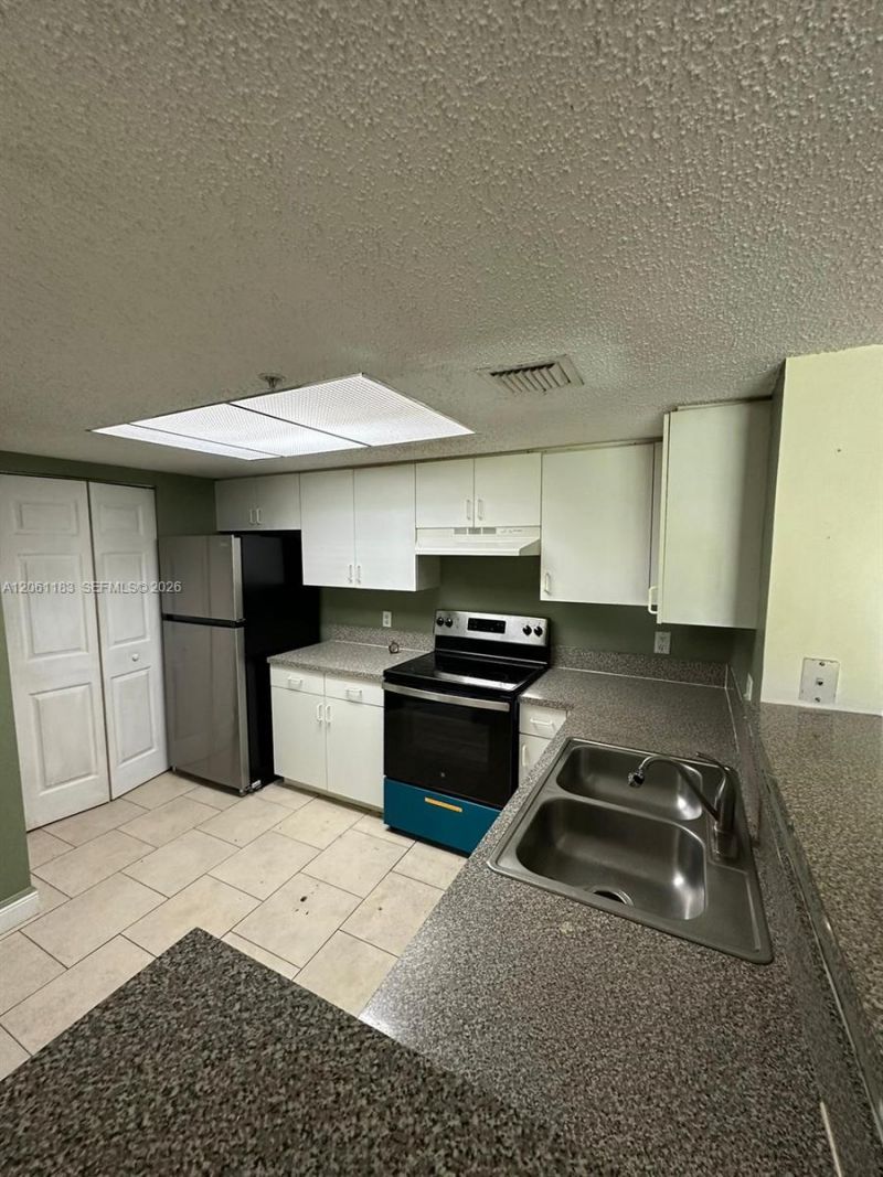 5005 Wiles Rd , Unit 102, Coconut Creek, FL 33073 Photo