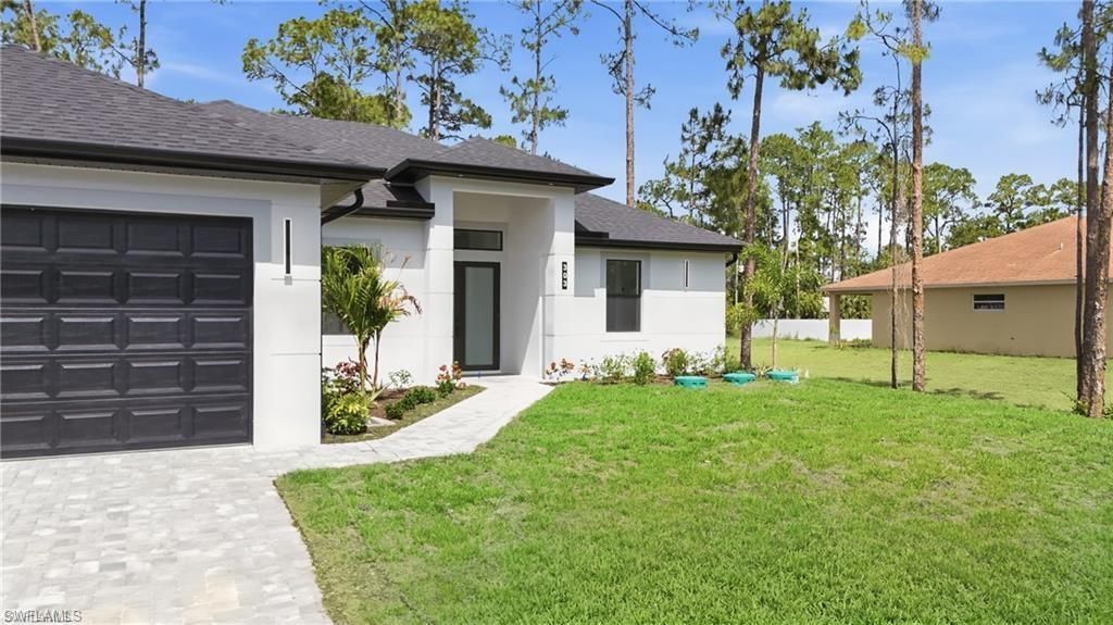 303 Mcarthur Ave , Lehigh Acres, FL 33936 Photo