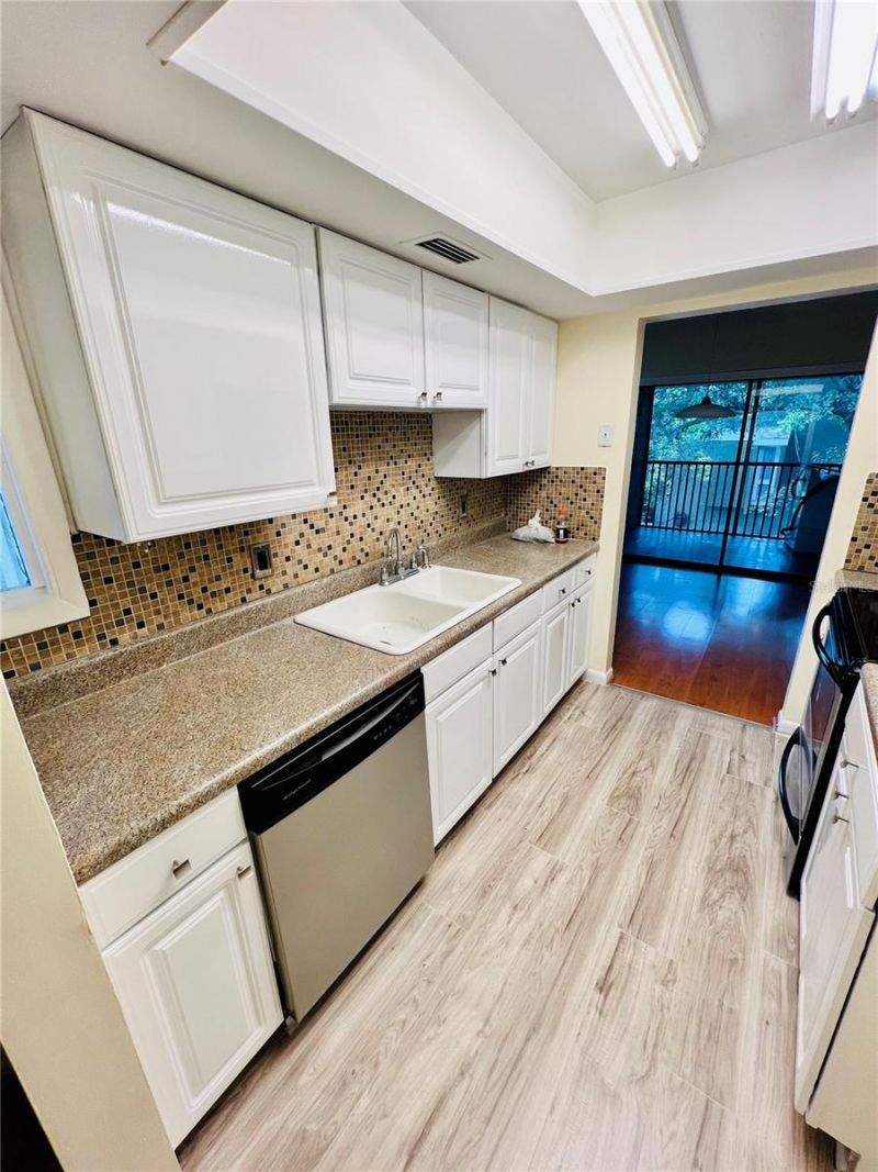 6057 Windhover Drive , Unit E-08, Orlando, FL 32819 Photo