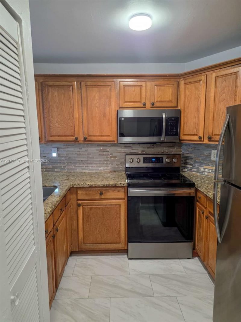 6955 NW 186th St , Unit F306, Hialeah, FL 33015 Photo