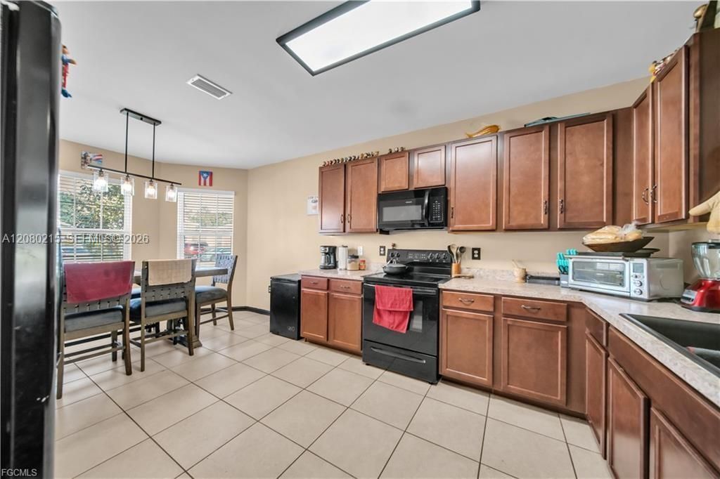 10549 Canal Brook Ln , Lehigh Acres, FL 33936 Photo