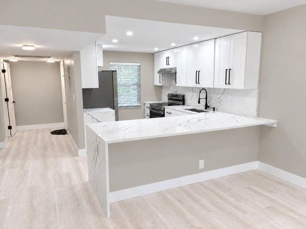 3900 Oaks Clubhouse Drive, Unit 101, Pompano Beach, FL 33069
